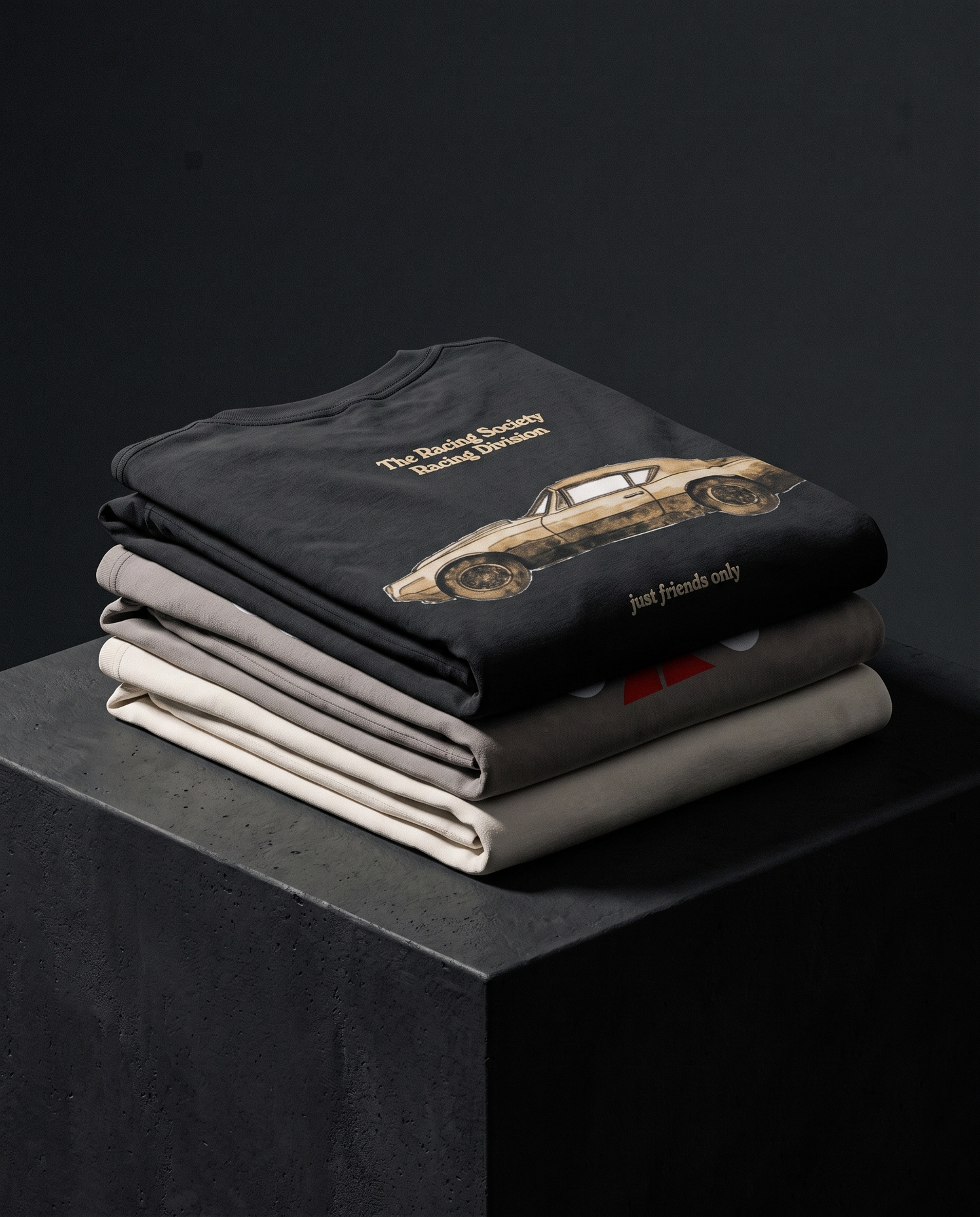 Oversized Faded Tees — folded stack, The Racing Society
