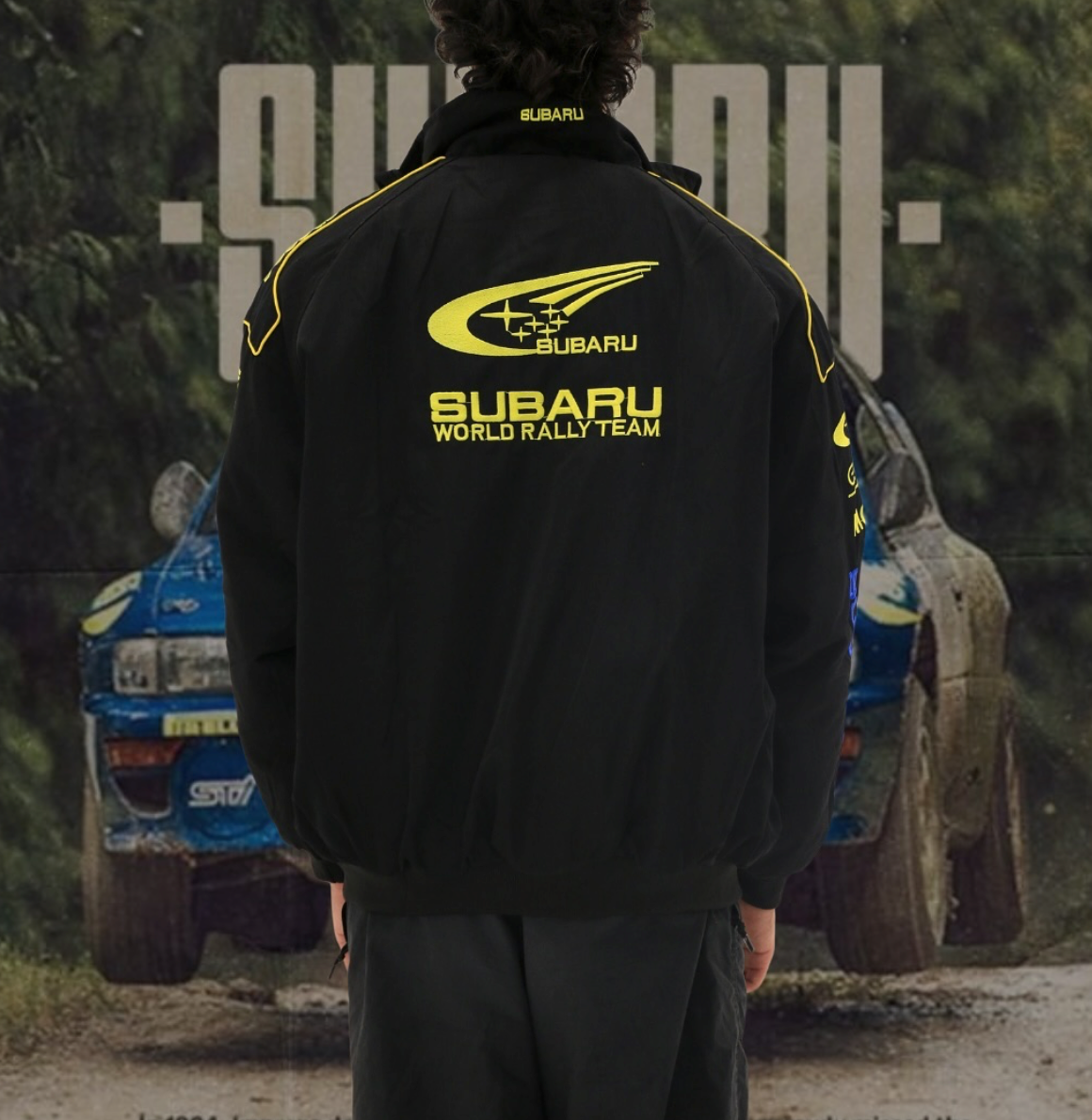 Subaru World Rally Team Vintage Racing Jacket – black with yellow and blue detailing, retro motorsport style shown front and back.
