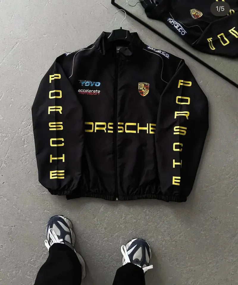 Porsche Racing Jacket front side with yellow text and logos, featuring a front zipper and pockets.