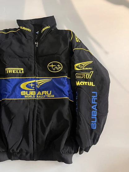 Subaru World Rally Team Vintage Racing Jacket – black with yellow and blue detailing, retro motorsport style shown front and back.