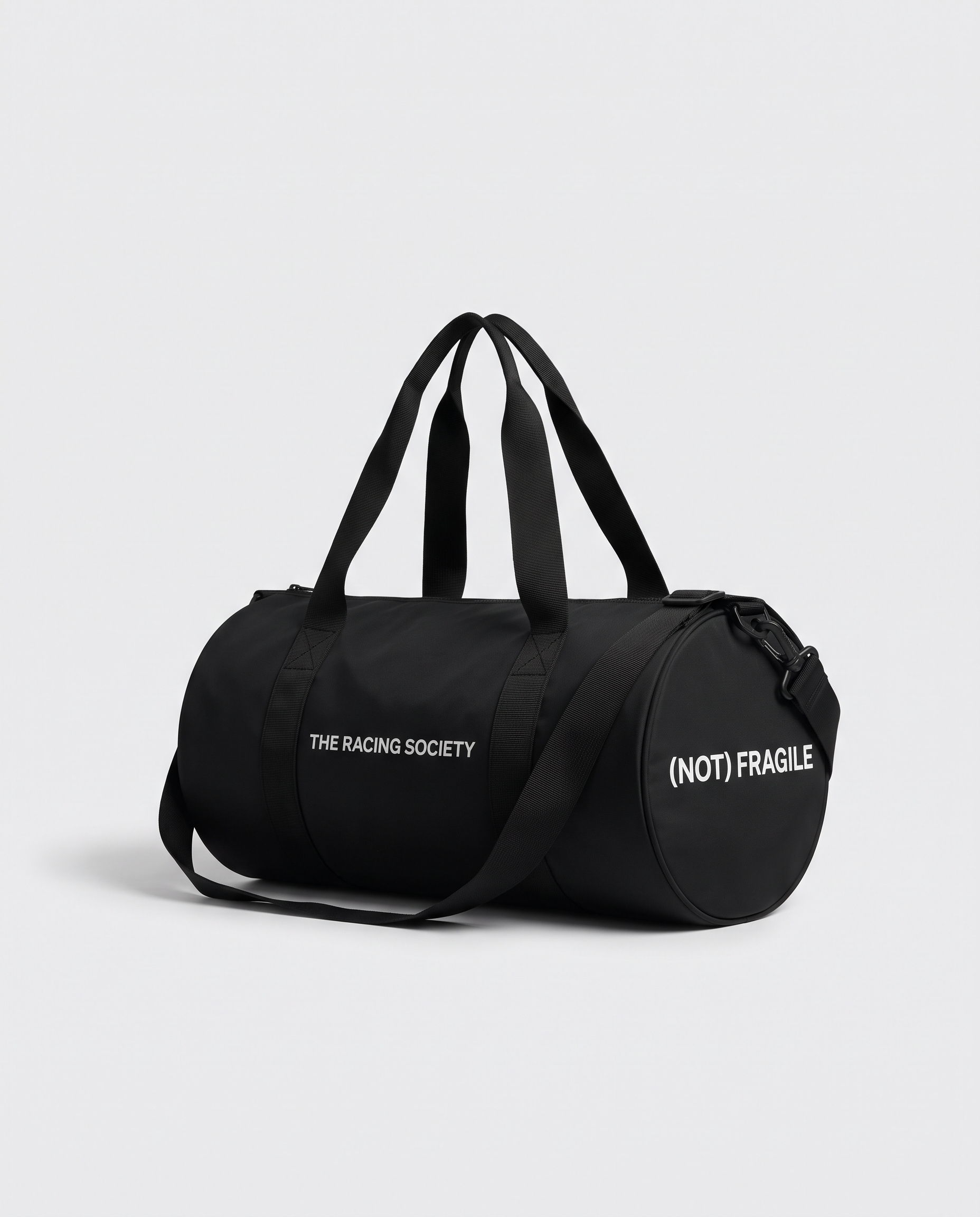 Wordmark black gym bag — studio hero