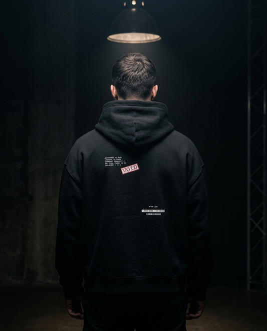 Fear Doesn't Pay Rent box hoodie — on-model back print, The Racing Society