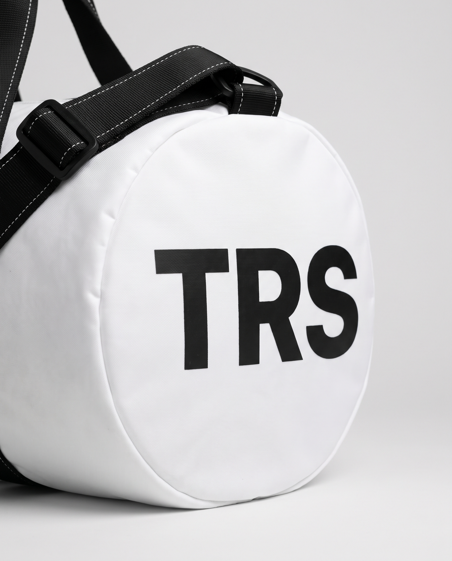 Wordmark duffle bag white — macro detail of TRS end print